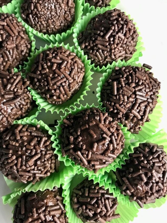 Brigadeiros in green paper in a plastic container This Brigadeiro Recipe is based on traditional Brazilian chocolate truffles rolled in sprinkles You won t believe how easy they are to make