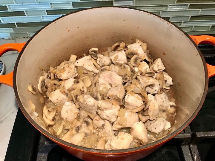 brazilian chicken stroganoff recipe, Chicken mushrooms and onions cooking in a dutch oven for Brazilian Chicken Stroganoff