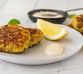 mussel fritters, Plated mussel fritters with wedge of lemon