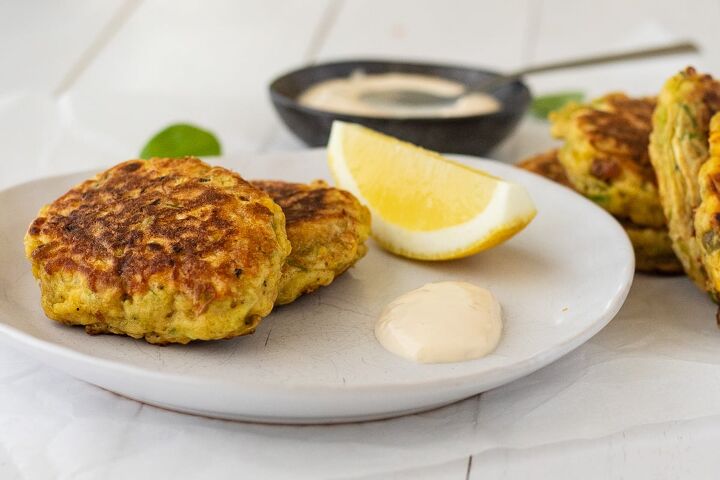 mussel fritters, Plated mussel fritters with wedge of lemon