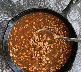 smoked baked beans with bacon and brown sugar, Stirring the beans into the onion jalapeno mixture in a large cast iron skillet