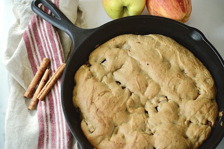 easy spiced sourdough apple oat cake recipe , apple cake in cast iron skillet with cinnamon sticks