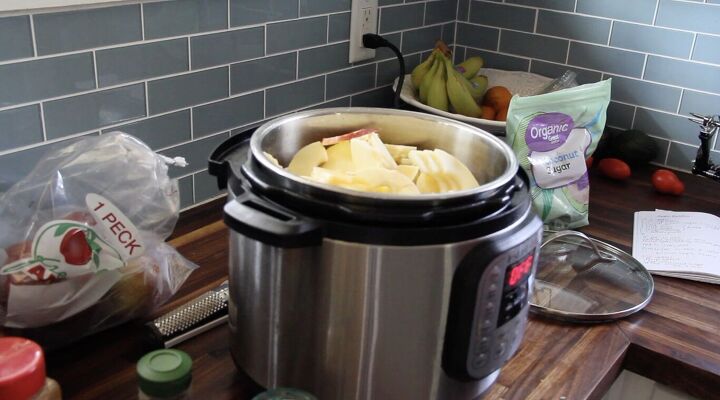 easy slow cooker apple butter, sliced and peeled apples in slow cooker