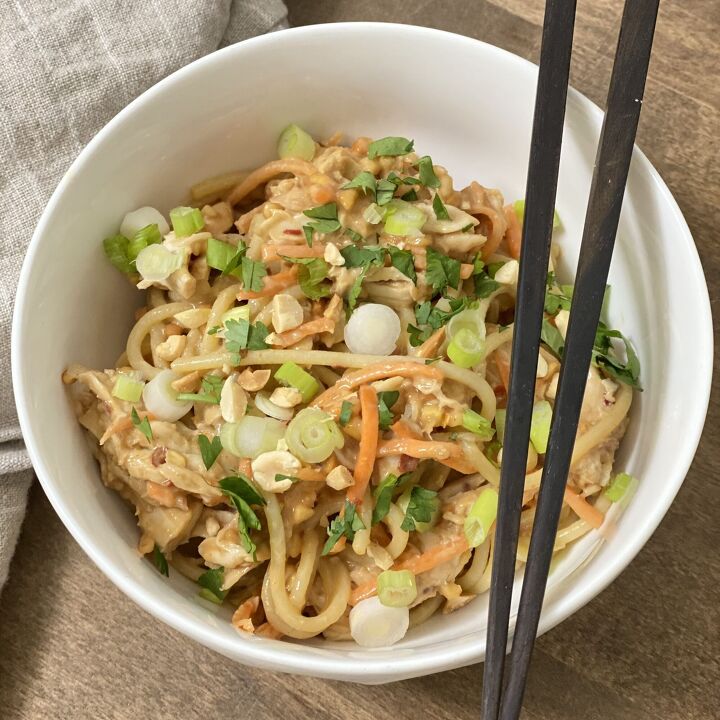 asian inspired chicken and noodles with peanut sauce, Chicken and noodles with peanut sauce in a white bowl with chopsticks