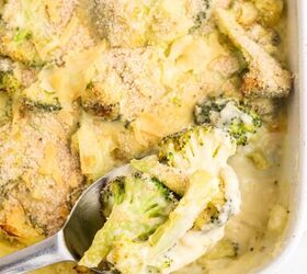 cheesy broccoli au gratin recipe, Cheesy Broccoli Au Gratin in a pan being scooped out with a spoon