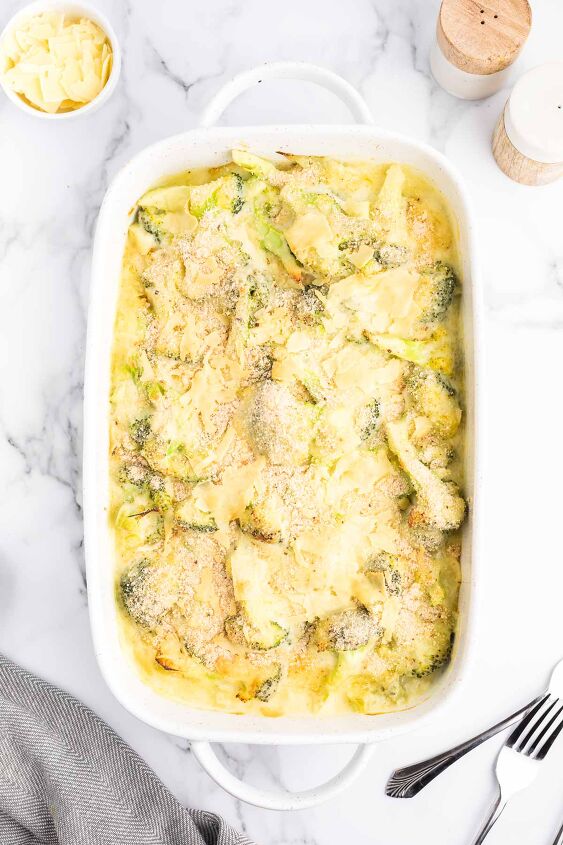 cheesy broccoli au gratin recipe, Cheesy Broccoli Au Gratin in a white casserole dish after being baked
