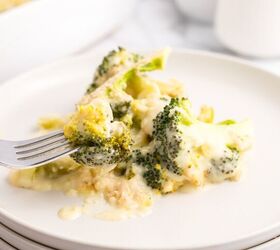 cheesy broccoli au gratin recipe, Cheesy Broccoli Au Gratin on a white plate with a fork