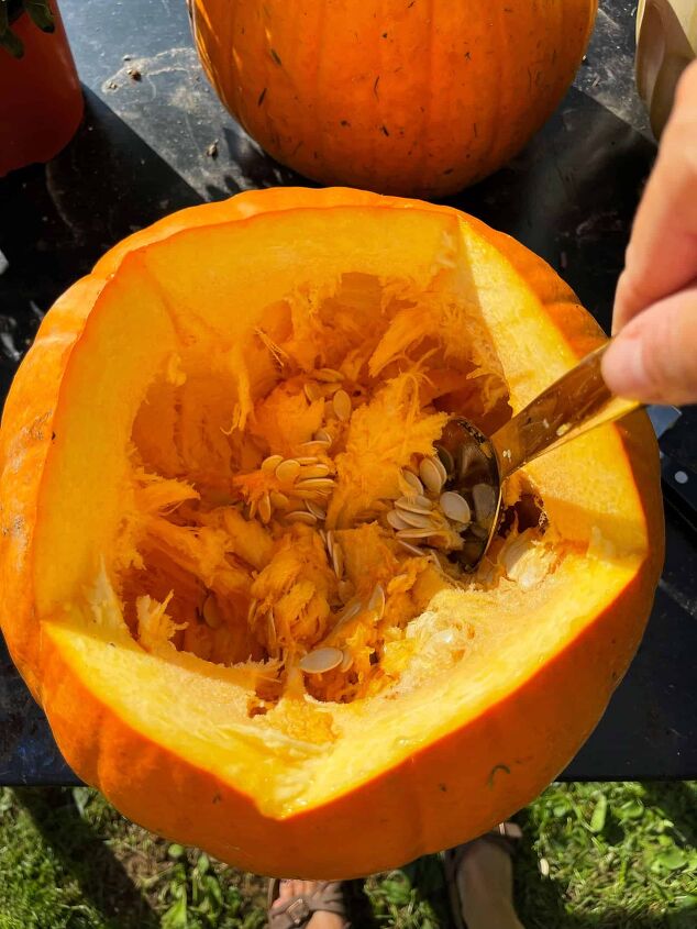 the best creamy pumpkin soup recipe, Removing the pumpkin flesh to make pumpkin soup for my thanksgiving aesthetic