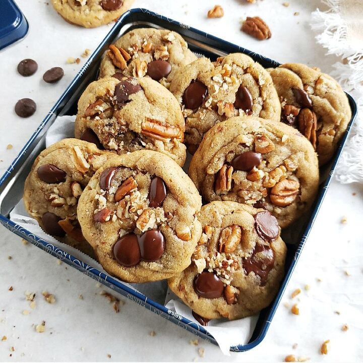 chocolate pecan pie bars, functional image chocolate chip cookies with pecans piled in a square blue cookie tin