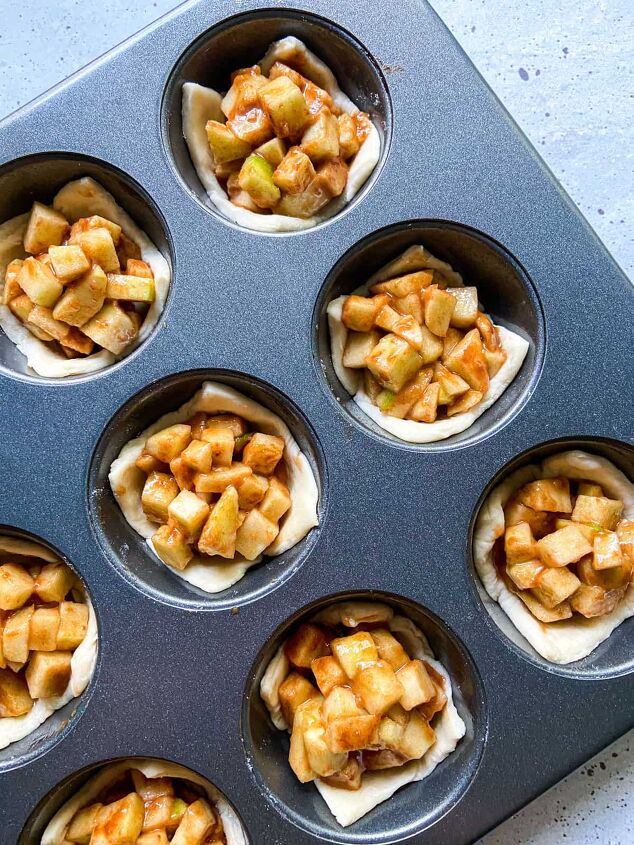 mini apple pies puff pastry, Line a muffin tin with puff pastry squares and fill each with prepared apple mixture