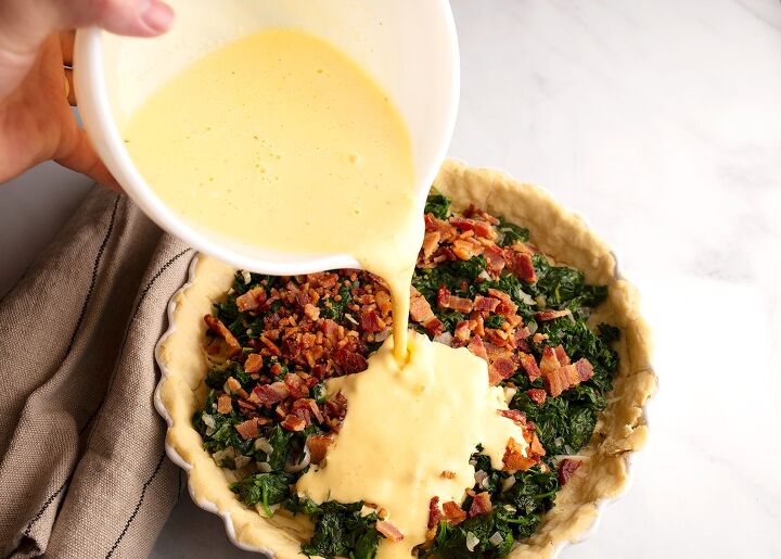 spinach and bacon quiche, Pouring the custard over the filling ingredients