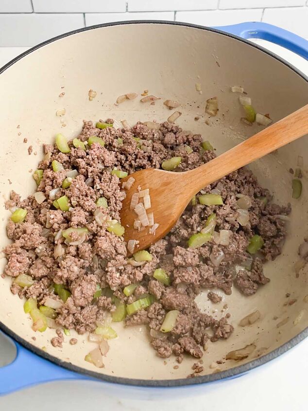 ground beef vegetable soup recipe, browned ground beef onions and celery in a Dutch oven