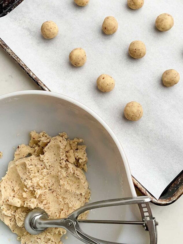 mexican wedding cookies, Mexican Christmas cookie dough in a white bowl and rolled into balls