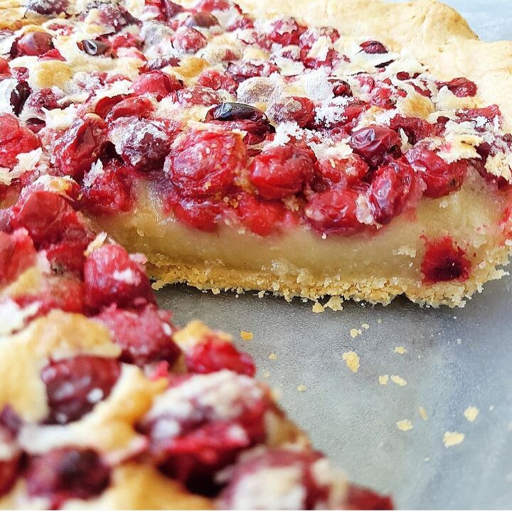cranberry custard pie, functional image cranberry custard pie side view of pie layers photographed in the pie plate layer are crust custard and cranberry topping