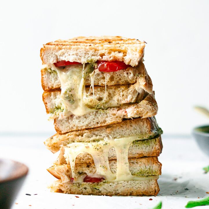pesto grilled cheese with garlic butter, stacked pesto grilled cheese sandwich with tomatoes