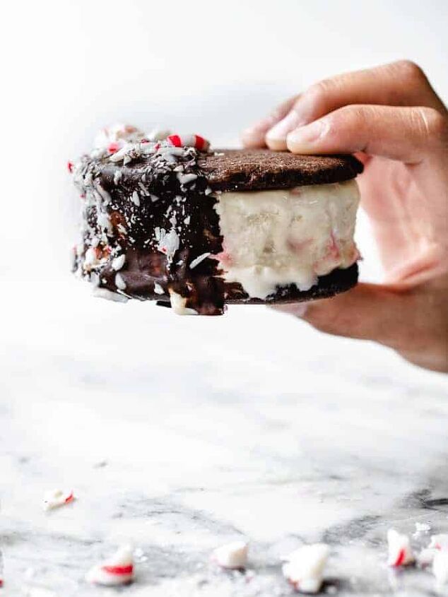 chocolate cookie ice cream sandwiches, Chocolate cookie ice cream sandwich with peppermint ice cream dipped in chocolate coating and sprinkled with crushed peppermint