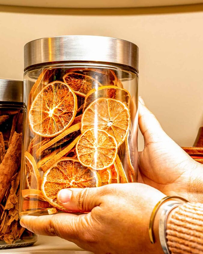 easy oven dried orange slices, person holding dried orange slices