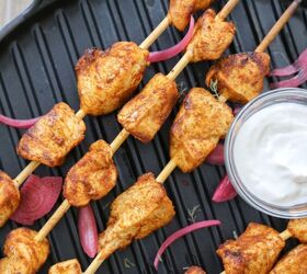 peruvian style oven chicken kabobs, Peruvian style chicken oven kabobs on a grill pan with pickled red onions and a white dipping sauce