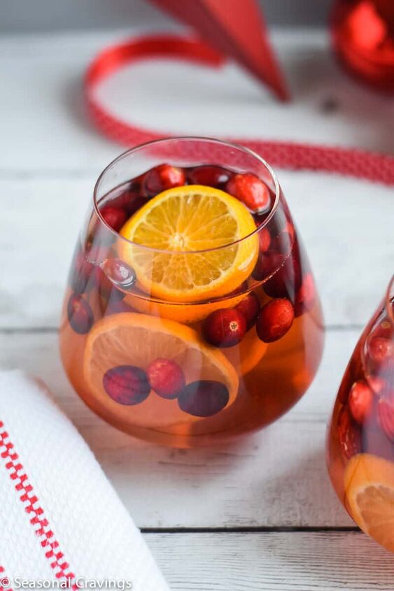 five ingredient white sangria, Five Ingredient White Sangria in a glass with oranges and cranberries