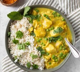 creamy curry chicken and rice, curried chicken and rice in a bowl with turmeric on the side with coconut milk a campbells chicken soup recipe
