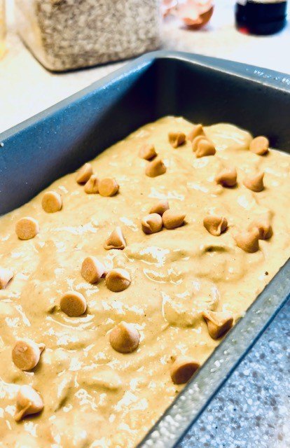 the best gluten free pumpkin bread, Pouring the pumpkin batter in the loaf pan