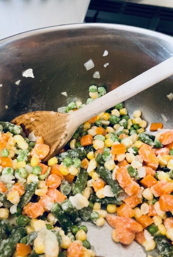 easy gluten free chicken pot pie, Adding the vegetables to the mixture