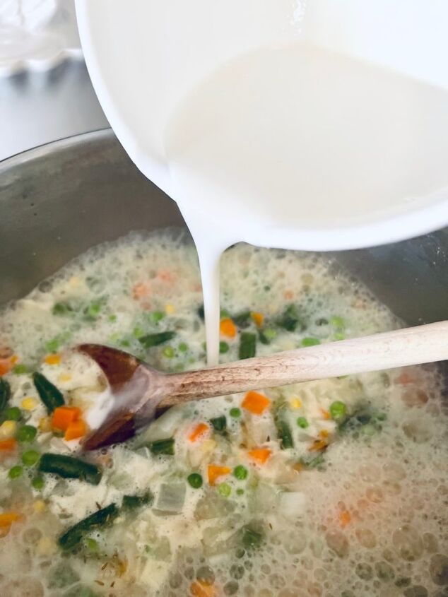 easy gluten free chicken pot pie, Pouring the milk mixture in with the chicken mixture