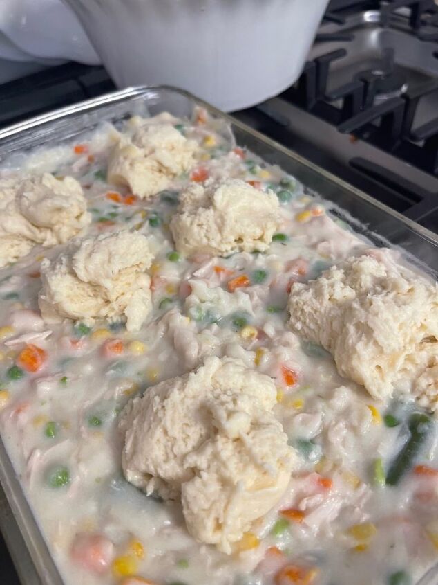 easy gluten free chicken pot pie, spooning the bisquick filling on the mixture