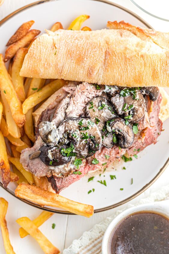 prime rib sandwich, Open faced leftover prime rib sandwich on a plate with fries