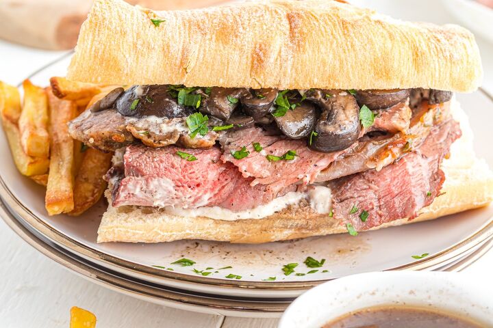 prime rib sandwich, Roast beef on a baguette on a plate with fries