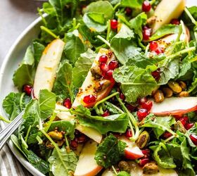 kale and apple salad with maple mustard dressing, close up off kale salad with apples and pomegranate arils
