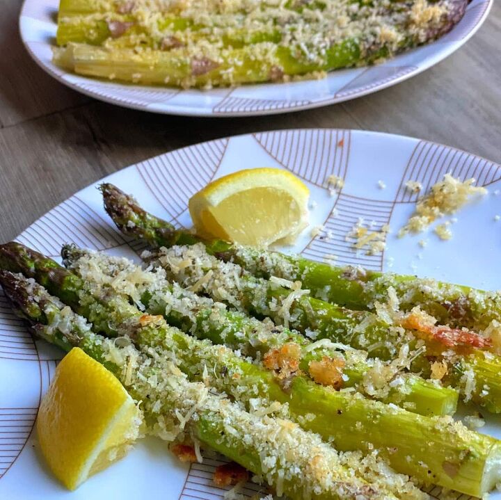 roasted asparagus with parmesan lemon, plated roasted asparagus with parmesan crumbles and lemon wedges