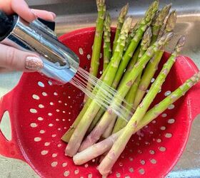 roasted asparagus with parmesan lemon, rinsing asparagus spears in sink in red colander