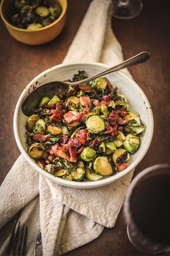 brussels sprouts with bacon, A bowl of brussel s sprouts with bacon and a spoon
