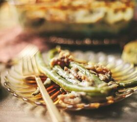 how to make green bean casserole with fresh green beans, A plate full of green bean casserole with gold forks and fried onions