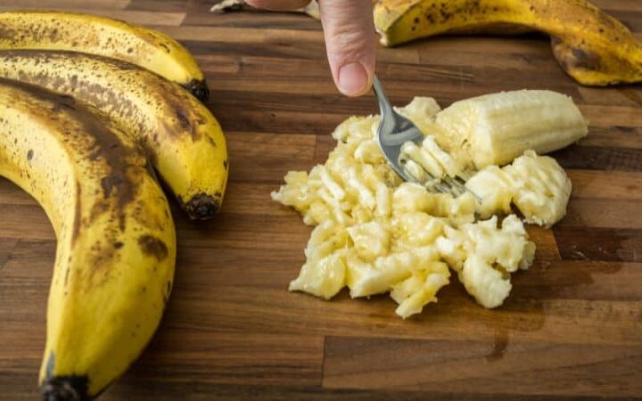 best ever gluten free banana bread, mashing bananas with a fork