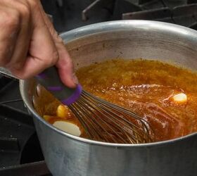 close up of a whisk mixing fresh home made caramel in a sauce pan