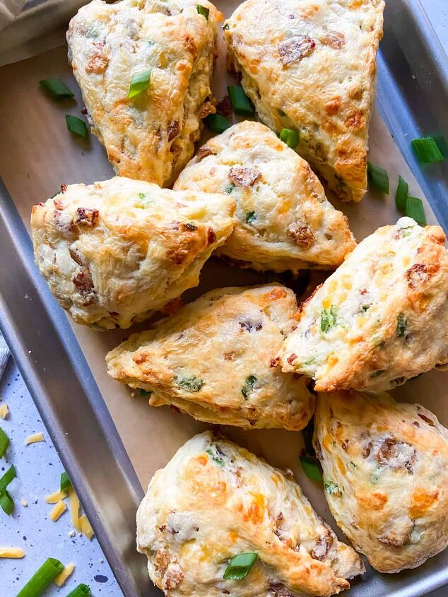 bacon cheddar scones, An array of scones on a parchment lined sheet tray