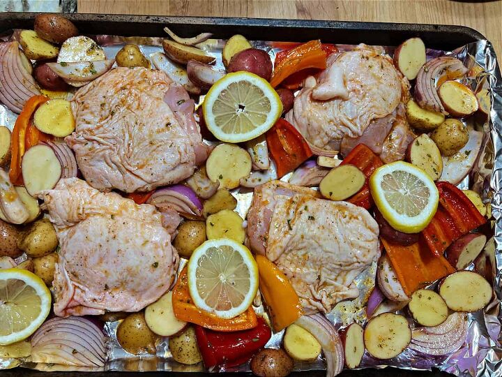 mediterranean chicken sheet pan dinner, sheet pan of Mediterranean chicken and vegetables ready to bake