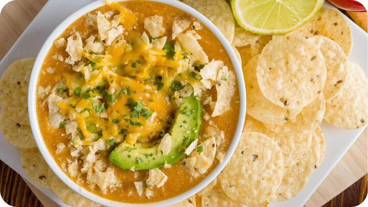classic chicken noodle soup with a twist, chicken noodle soup with cheddar cheese tortillas and avocado on top