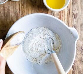 savory buttermilk cheddar belgian waffles, salt sugar baking powder and flour poured into a white mixing bowl