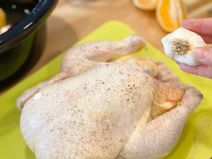 slow cooker orange chicken, placing whole head of garlic in cavity of chicken
