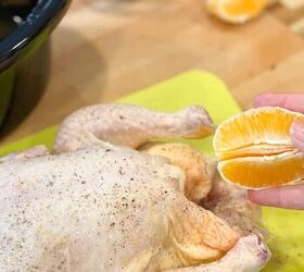 slow cooker orange chicken, placing orange sections inside of cavity of whole chicken