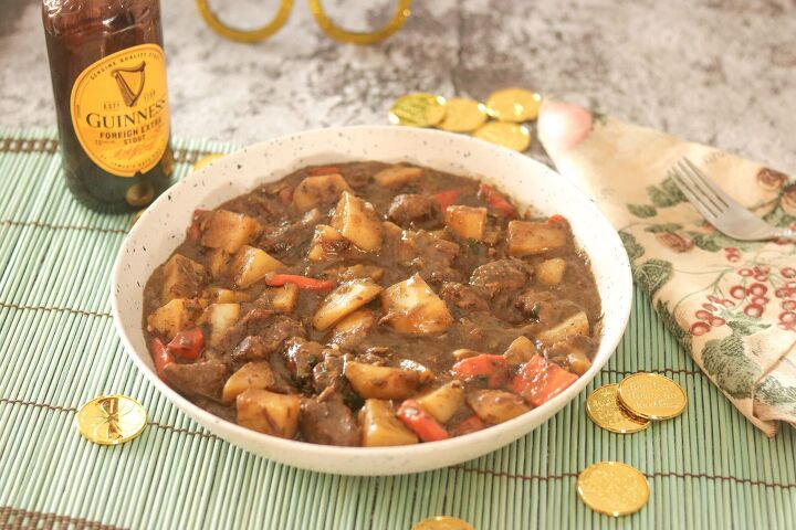 best irish lamb stew with guinness how to make traditional irish ste, Irish Lamb Stew in a bowl with Guiness and gold coins in the background
