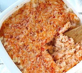 brazilian baked rice with cheese and tomatoes, Spatula scooping Baked Rice with Cheese and Tomatoes up from casserole dish