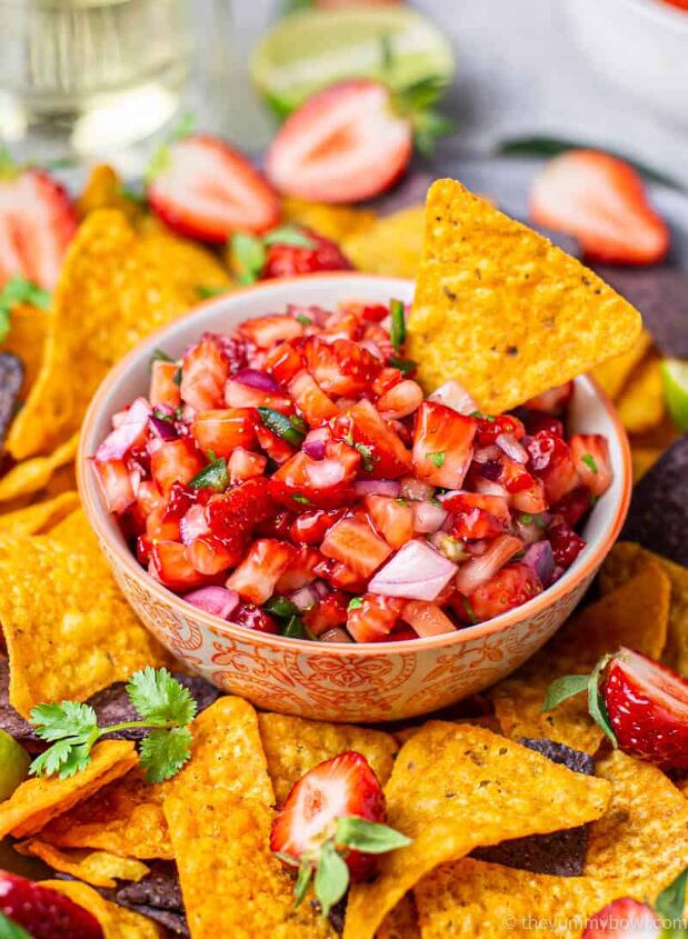 strawberry salsa, strawberry salsa in a bowl with nachos tortilla chips around