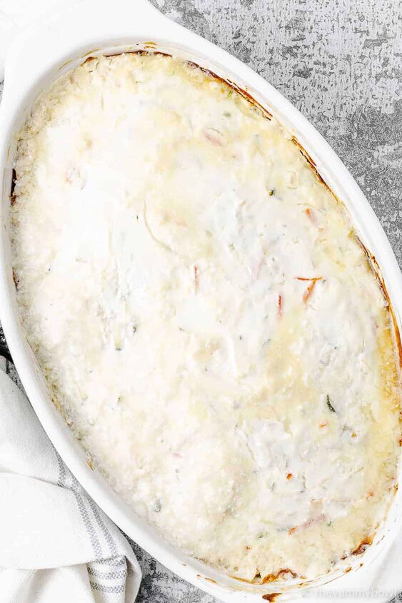 chicken zucchini casserole, Chicken Zucchini Casserole in a white oval baking dish process