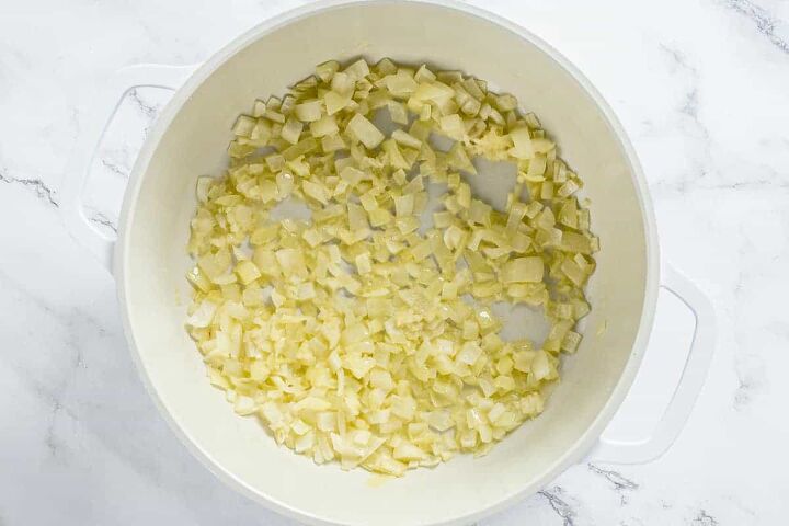 butternut squash risotto, sauteed onion and garlic in a white dutch oven