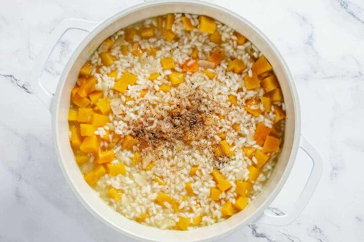 butternut squash risotto, pumpkin risotto ingredients simemring in a white dutch oven
