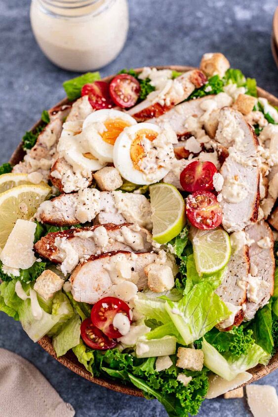 healthy lemon kale caesar salad with chicken, Lemon Kale Caesar Salad with chicken in a white bowl